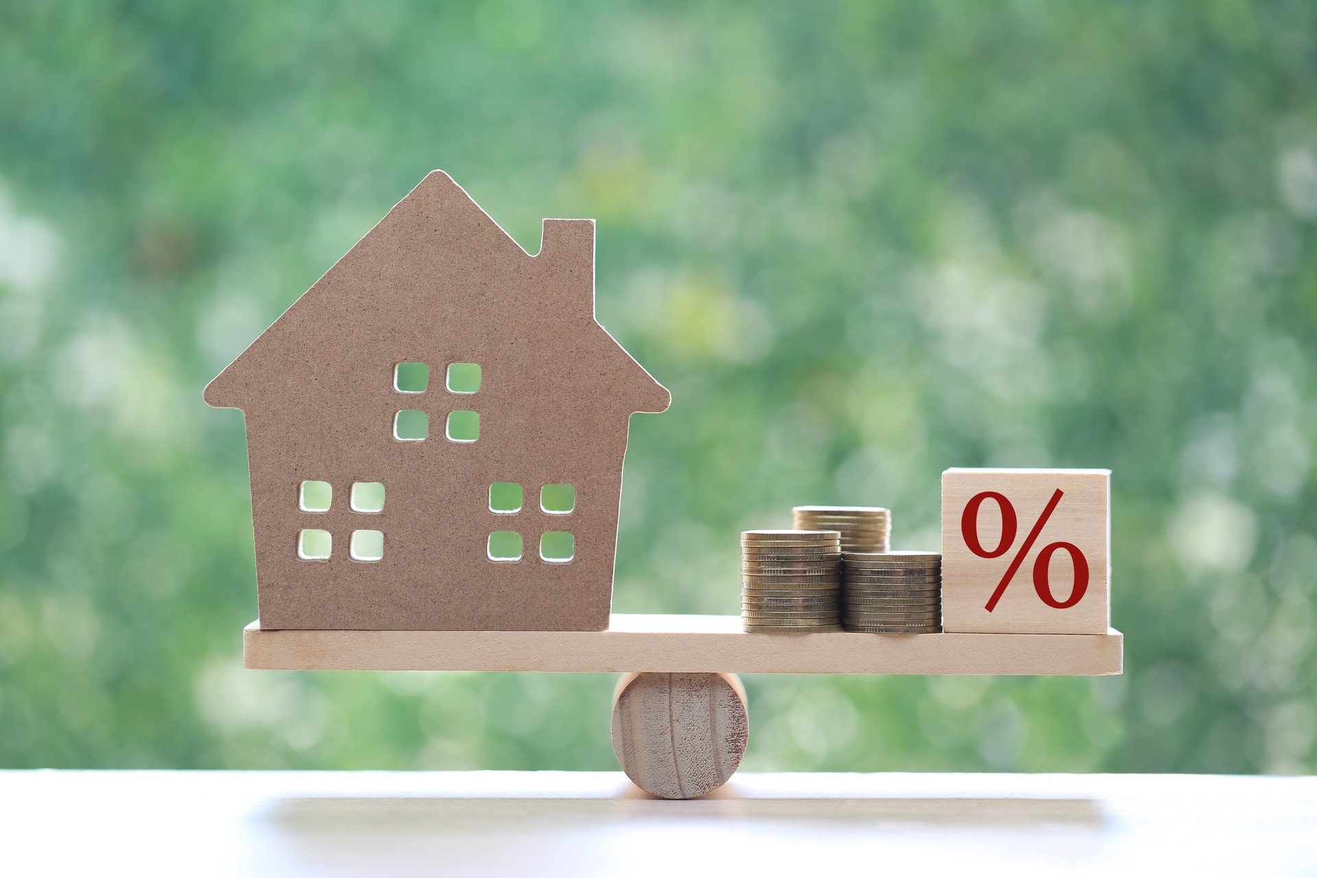 Estate tax,Model house with Percentage symbol icon on green background,Business investment and Property tax concept